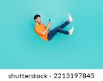Full body photo of guy blogger falling downward using device incredible news sale isolated on cyan color background