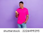 Portrait of cheerful man with fade haircut wear pink t-shirt telegram instagram facebook whatsapp isolated on purple color background