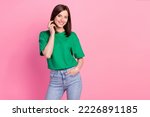 Photo portrait of stunning young woman hand touch hair posing clothes promo dressed trendy green look isolated on pink color background