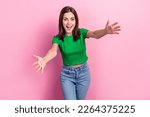Portrait of astonished positive girl toothy smile raise opened arms welcome you isolated on pink color background