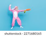 Small photo of Full length photo of charming cool pensioner guy dressed bunny kigurumi fighting carrot sward empty space isolated blue color background
