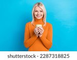 Photo of satisfied business lady hold cup coffee morning inspiration hot beverage wear trendy sweater isolated on cyan color background