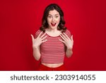 Photo of charming curly lady stunned happiness touch chest not believe she win prize isolated red maroon color background