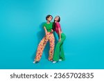 Full body length photo of two coquette flirting girls friendship posing stunning models romantic night isolated on blue color background