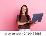 Small photo of Photo of smiling business woman successful monetize content in social media using laptop looking mockup isolated on pink color background