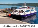 Small photo of LOUGH NESS, SCOTLAND, JUNE, 27, 2019: Passengers boarding a boat before their tour of Lough Ness, Scotland, UK.