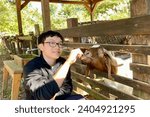 Feeding goats at the Leo Foo Resorts
