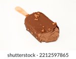 chocolate ice cream stick coated and covered with a layer of dark chocolate with nuts, Rich flavoured ice cream in cracking brown chocolate crunch and roasted almond, selective focus