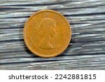 Small photo of Bust of Queen Elizabeth II, as at 27 years of age, wearing a wreath, facing right (1st portrait) from the obverse side of Canadian 1 one Cent series 1954 with DEI GRATIA REGINA (by the grace of God)