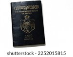 Small photo of Cairo, Egypt, January 18 2023: Jordanian passport Identity for citizens, Kingdom of Jordan Hashemite Passport with Jordan's coat of arms issued to citizens of Jordan by civil status department