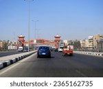Small photo of Cairo, Egypt, September 17 2023: Shinzo Abe axis patrol highway with a pedestrian bridge finished in traditional Japanese architectural style, the traffic highway is named on former Japanese PM