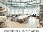 Interior of a sewing warehouse of furniture factory with equipment and materials