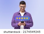 Small photo of Picture with five star rating icon and hipster man customer in purple jacket giving excellent feedback for prefect service on smartphone, isolated on blue gradient background
