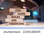 Wooden blocks with words 'The Game Rules Are Changing'.