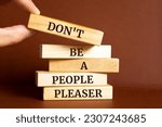 Small photo of Wooden blocks with words 'Don't Be a People Pleaser'.