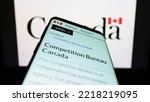 Small photo of Stuttgart, Germany - 10-14-2022: Mobile phone with web page of Canadian regulator Competition Bureau on screen in front of logo. Focus on top-left of phone display. Unmodified photo.