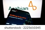 Small photo of Stuttgart, Germany - 10-18-2022: Mobile phone with website of Saudi business Arabian Drilling Company (ADC) on screen in front of logo. Focus on top-left of phone display. Unmodified photo.