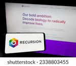 Small photo of Stuttgart, Germany - 07-19-2023: Person holding mobile phone with logo of American company Recursion Pharmaceuticals Inc. on screen in front of web page. Focus on phone display. Unmodified photo.