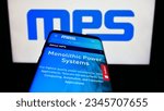Small photo of Stuttgart, Germany - 08-05-2023: Mobile phone with website of US company Monolithic Power Systems Inc. (MPS) on screen in front of logo. Focus on top-left of phone display. Unmodified photo.