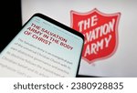 Small photo of Stuttgart, Germany - 10-09-2023: Mobile phone with webpage of Protestant charity organization The Salvation Army (TSA) in front of logo. Focus on top-left of phone display. Unmodified photo.
