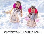 Little Girls Throw Snowball In...