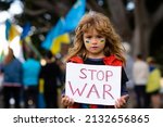 Kids with poster with banner of russia conflict, military protest. Child with message Stop War. America stand with Ukraine.