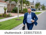 Small photo of Business man run near house in american neighborhood. Businessman run down street, late for a meeting. Businessman in suit run be success. Running business man. Fast business. Run and late business.