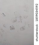 Small photo of Footprint effects on the walls of a parking lot. An irresponsible act.