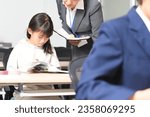 Small photo of Image of a female student and a cram school teacher studying during class