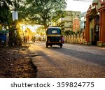 Small photo of CANDOLIM, INDIA - 26 FEBRUARY, 2015: life on the street of the exotic little town Candolim. For any adventurer ant tourist main interest is very good Candolim beach.