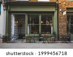 Empty coffee and restaurant terrace with tables and chairs in london indie and hipster style