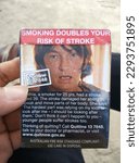 Small photo of Hobart, Tasmanian, Australia - Dec 7 2015: Empty Australian Cigarette Package with Stroke Warning Sign