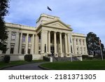 Small photo of St Kilda, Victoria, Australia - July 22 2022: Main facade and classical portico of the grand St Kilda Town Hall, also known as St Kilda City Hall, during a cloudy afternoon