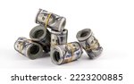 Small photo of Several rolled-up bundles of 100 American dollars bills on white background