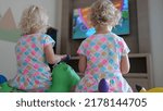 Children watch cartoons on tv...