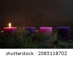 Advent wreath with one pillar candle burning for the first week of advent 