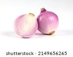 Red onion, peeled, halved, close-up placed on a white background