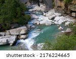 Small photo of Scenic view of Reuss River at famous Schollenen Gorge on a sunny summer day
