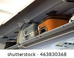 hand-luggage compartment with hand-luggage in an airplane
