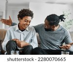 Small photo of Portrait of a happy teenage boy son talking to his father at home. Sharing secrets and having fun, support and parenthood concept