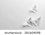White origami butterflies on white background