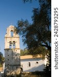 Small photo of The stone belltower of agios constantinos surrounded by olive trees, paxos, ionian islands, greek islands, greece, europe