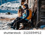 Mountaineer backcountry ski walking ski woman alpinist in the mountains. Ski touring in alpine landscape with snowy trees. Adventure winter sport. Freeride skiing