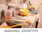 Small photo of Huge heap of dirty dishes waiting for the flatmate in the kitchen