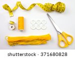 Yellow Sewing Accessories and Tape Measure.