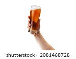 Cropped image of male hand holding glass of lager foamy beer isolated over white background. Oktoberfest drink. Concept of alcohol, drink, party, degustation, holiday. Copy space for ad