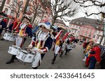 Small photo of Mainz, Germany - February 11, 2024: Traditionally, shouting 3x "Helau" and celebrating on the streets with kids, MTV-Guggemusik-Festival am Fastnachtsonntag.