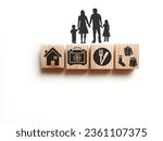 wooden cube with icons of food, Clothing, housing, medical bag, four basic human needs concepts. The Four Basic Material Needs of the Human Being.