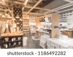 Small photo of Blurred abstract variety of cookshop and tableware at furniture retailer in Texas, USA. Defocused wide selection of kitchen, dining cookware utensils. Hand-held tools, gadget home necessities