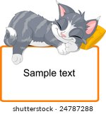 Cute Gray Cat Sleeping On Text...